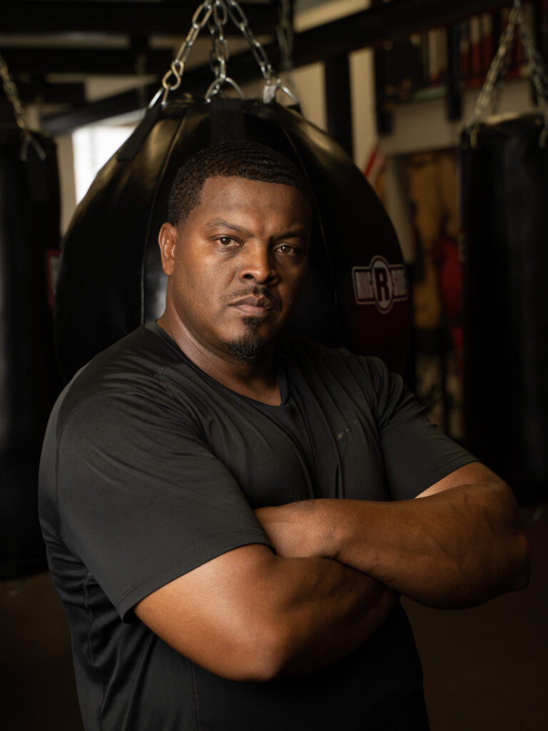 portrait of boxing coach in a gym setting