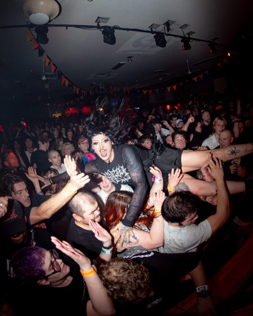 Crowd surfer above the audience during a live set at The Shrine