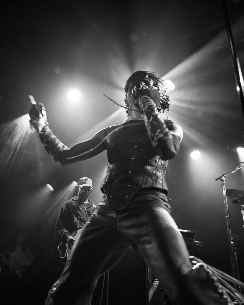 Duckwrth mid-performance in black and white at Treefort Music Hall