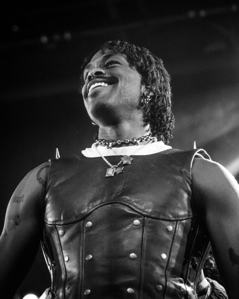 Duckwrth leaning back with the mic stand during a concert at Treefort Music Hall