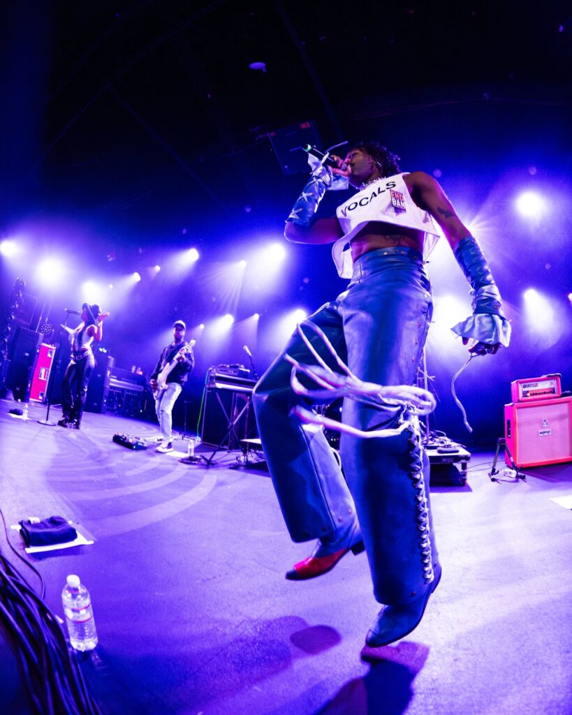 Duckwrth performing live in a leather vest at Treefort Music Hall