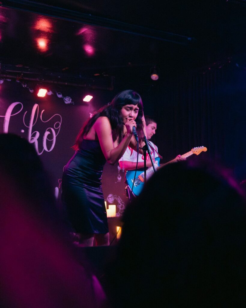 Niko Rubio singing on stage at Beat Kitchen, Chicago, in black and white